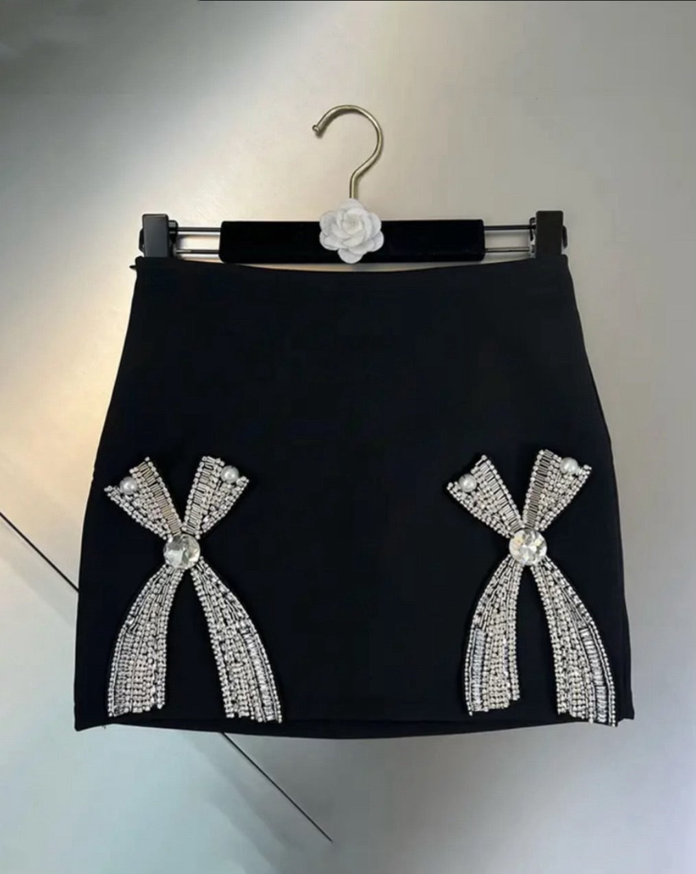 Pokkin twin diamond bow mini skirt